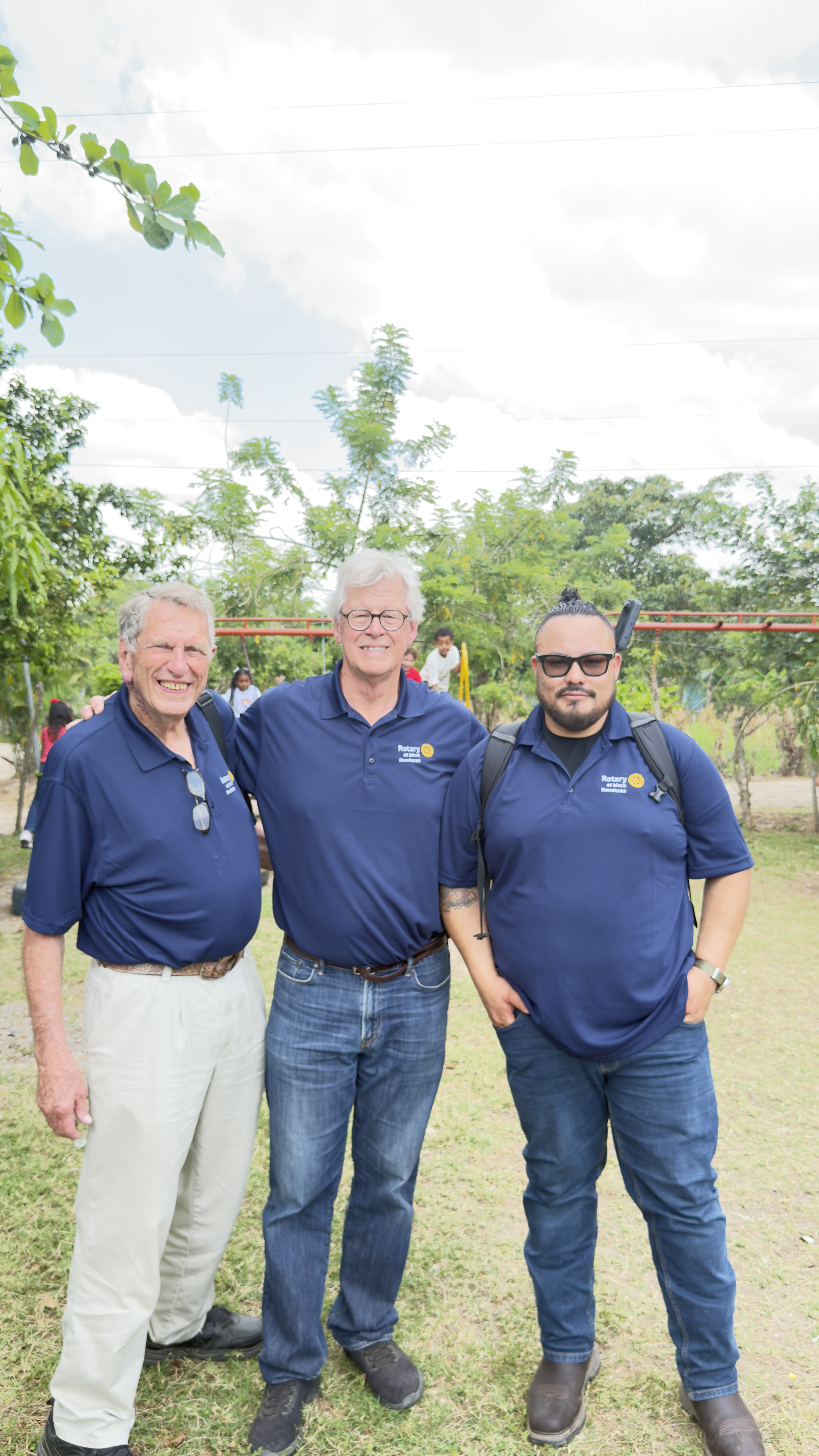 Three Rotarians in matching polos during a Honduras service trip.